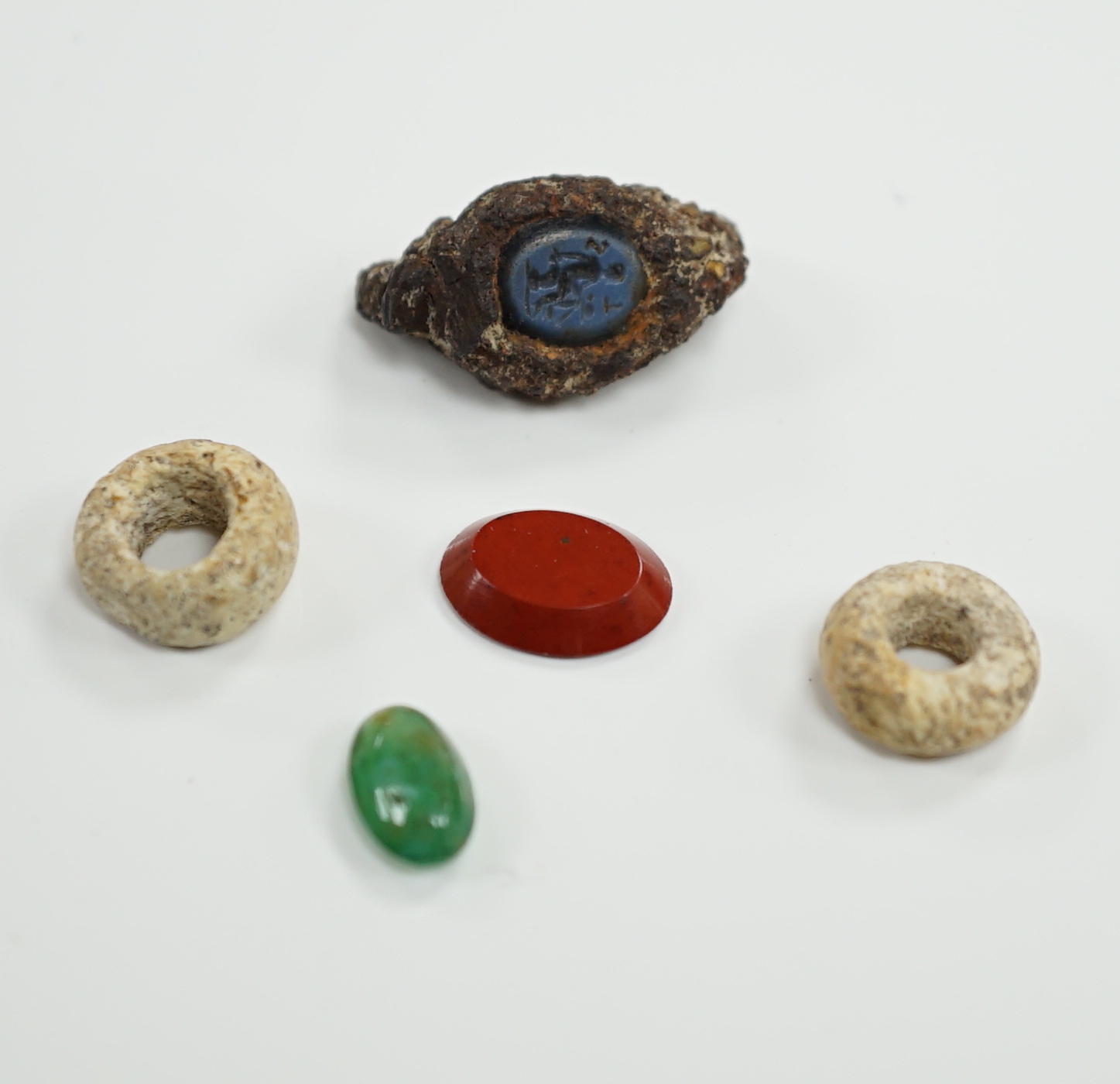 Three antique oval hardstone intaglios, including Roman?, carved with figures or cockerel, largest 10mm and two other items.